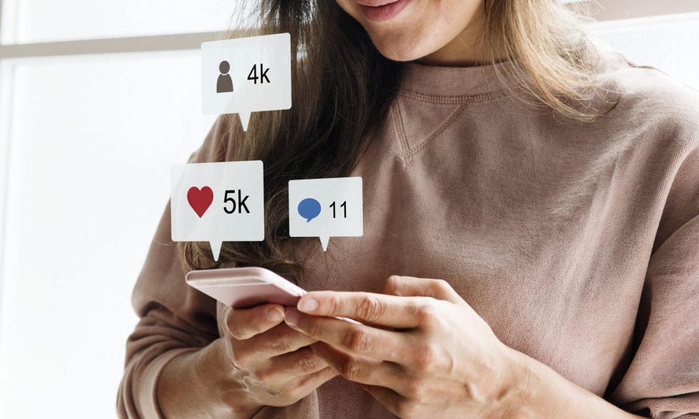 Woman using a smartphone social media conecpt